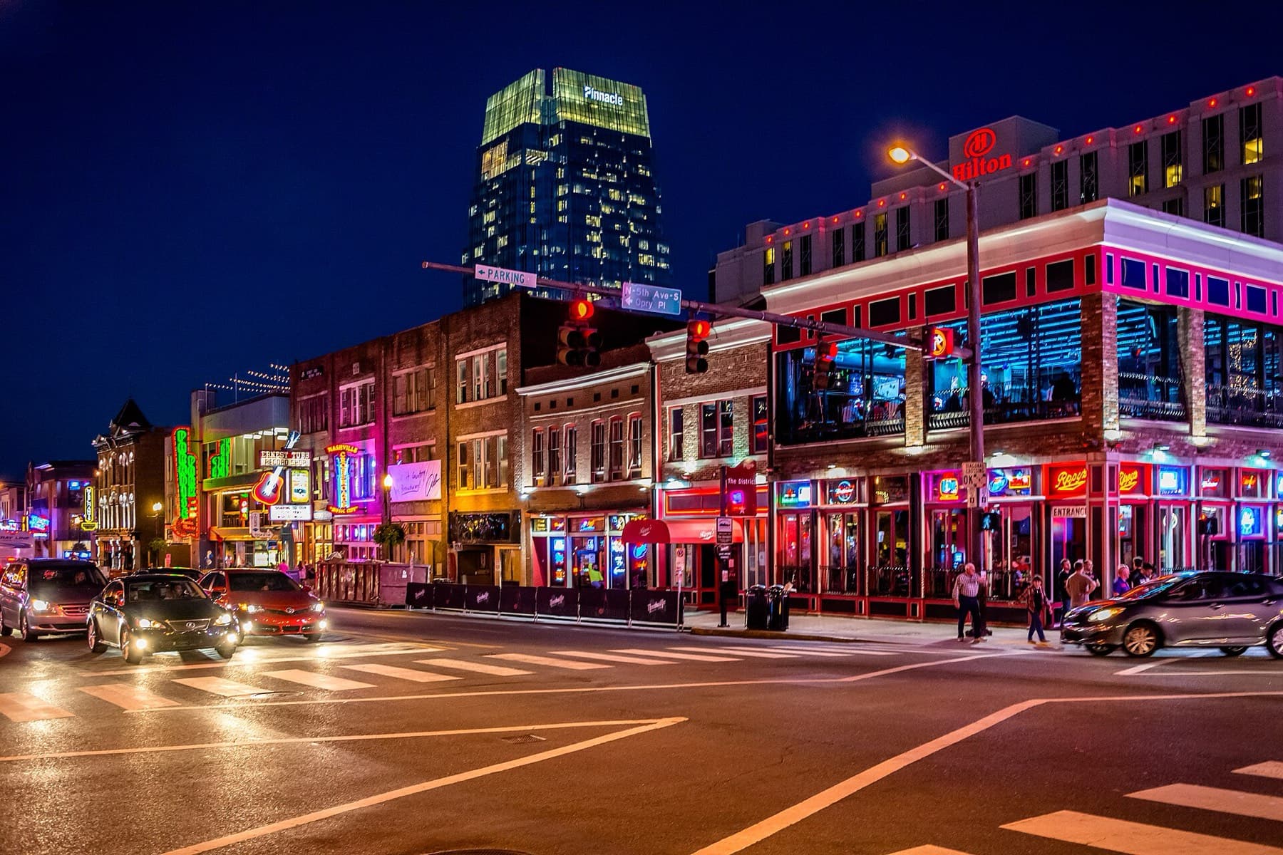 Neon-lit honky-tonks on Lower Broadway in Nashville at night